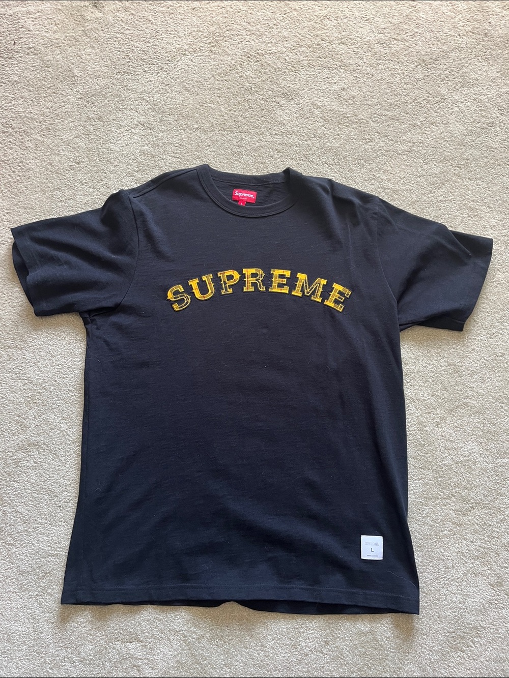 Supreme Black Tee with Yellow snd Black Plaid Script